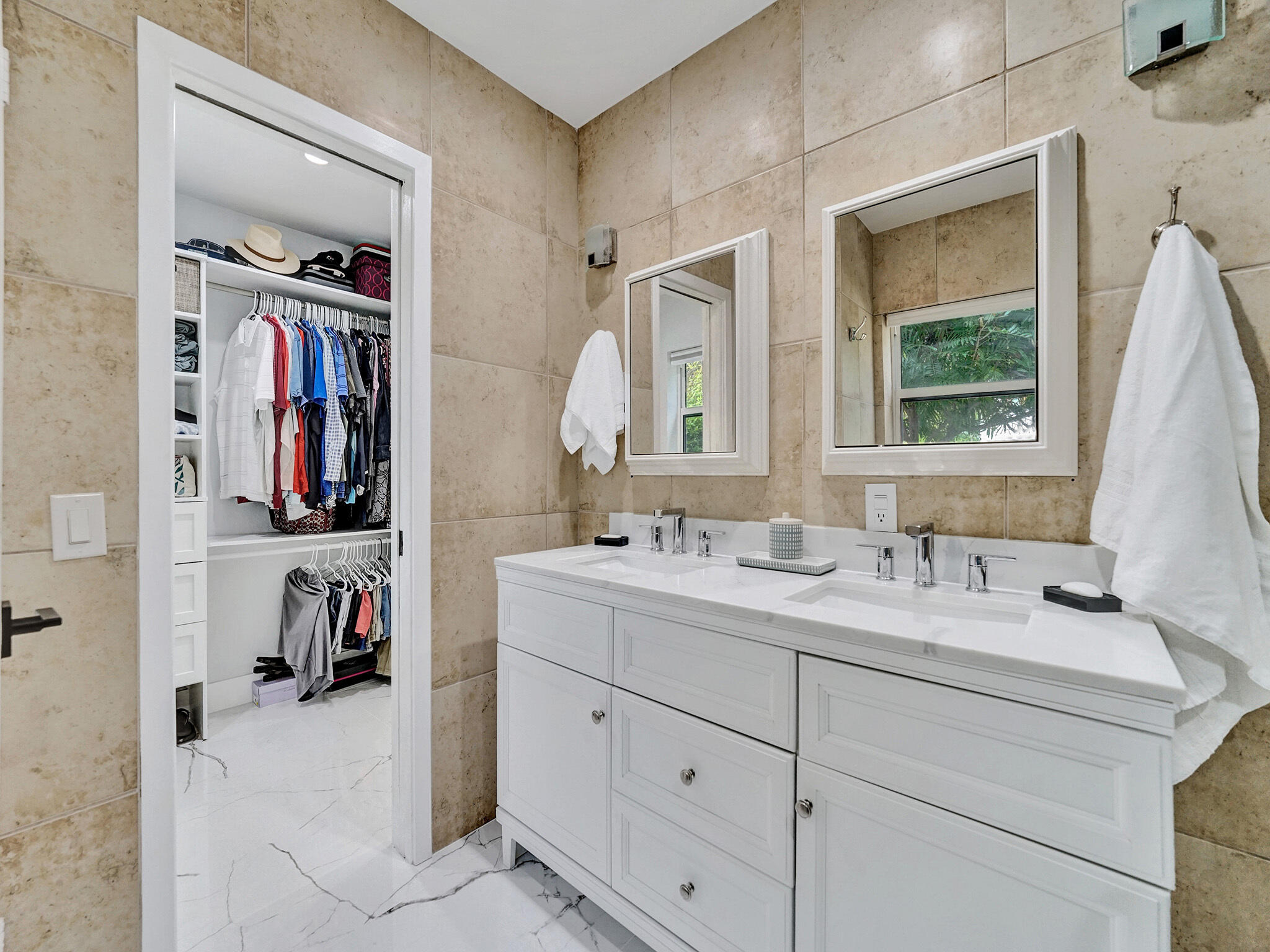 3204 Robbins Road Pompano Beach, FL 33062 - Photo 26 of 37 a en suite bathroom with a double vanity sink and a mirror