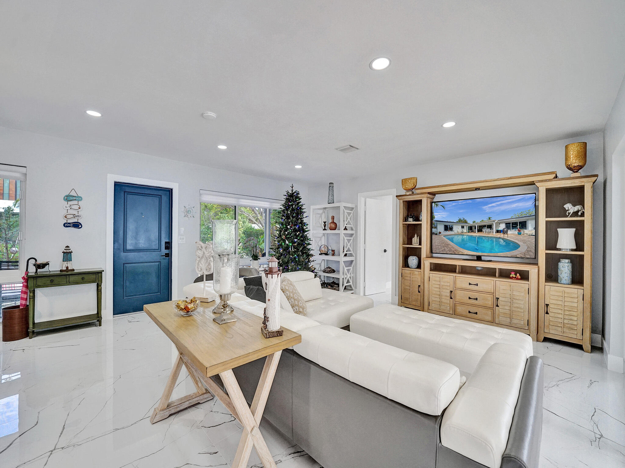 3204 Robbins Road Pompano Beach, FL 33062 - Photo 34 of 37 a living room with fireplace furniture and a flat screen tv