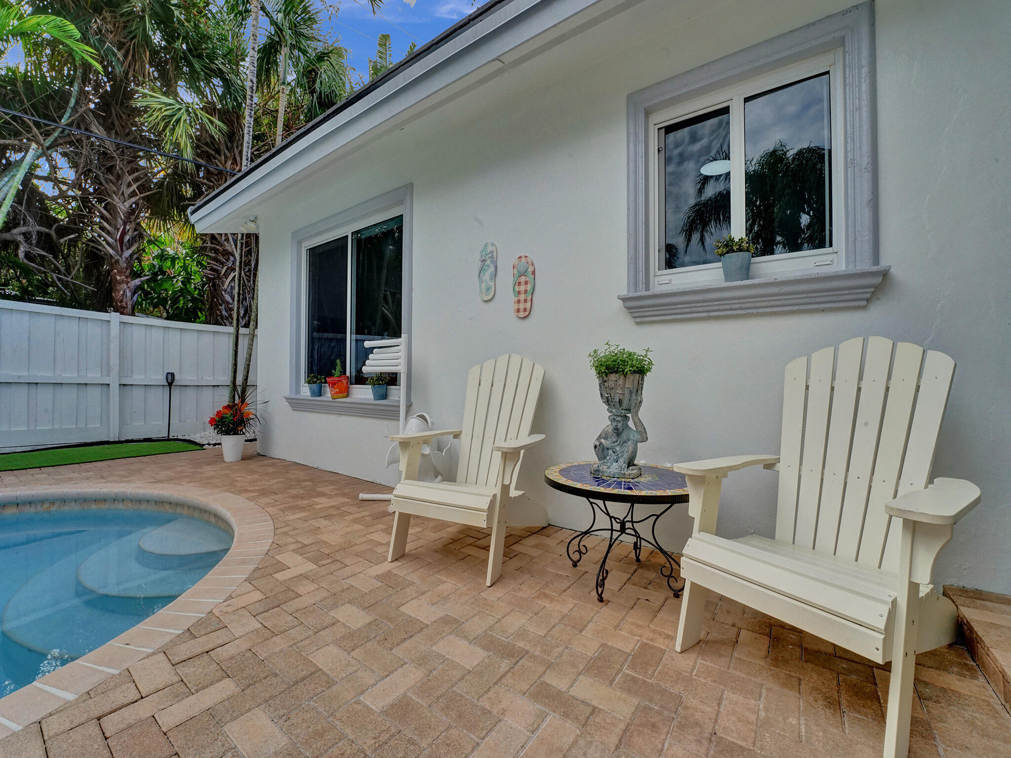 3204 Robbins Road Pompano Beach, FL 33062 - Photo 35 of 37 a view of a house with backyard and sitting area