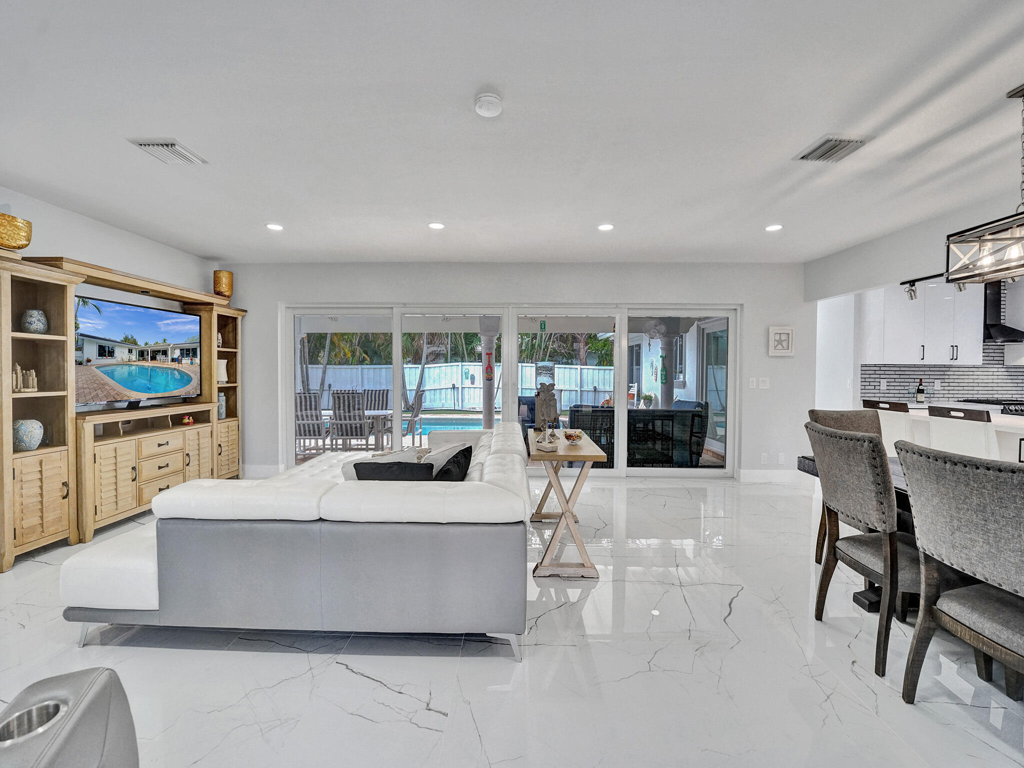 3204 Robbins Road Pompano Beach, FL 33062 - Photo 9 of 37 a view of a living room kitchen and a large window