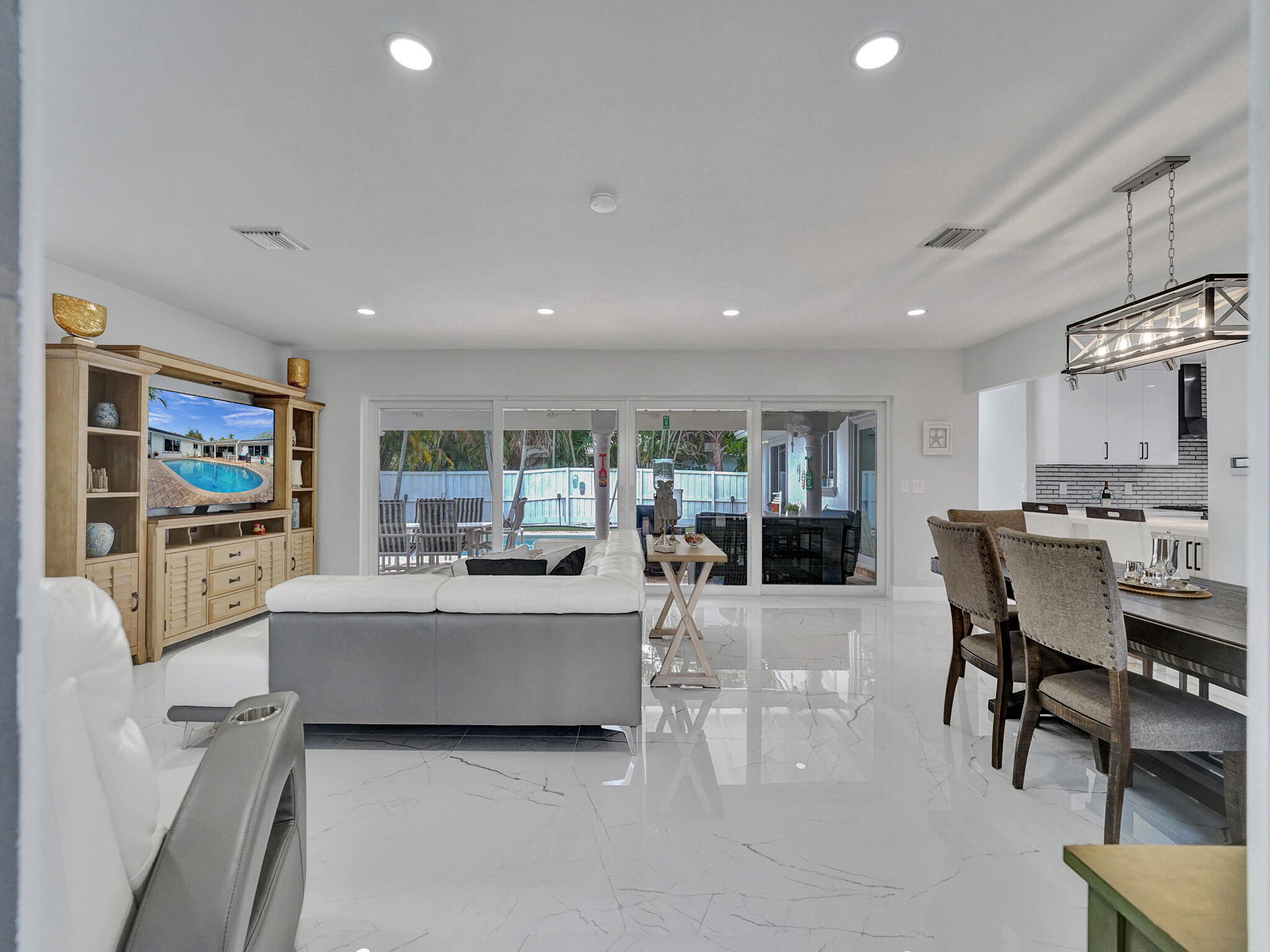 3204 Robbins Road Pompano Beach, FL 33062 - Photo 10 of 37 a living room with furniture and a large window