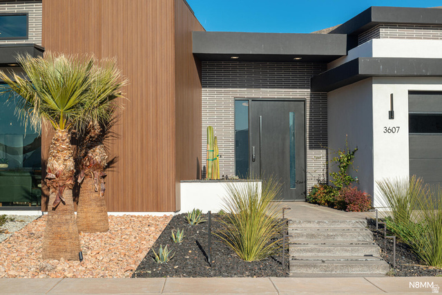 3607 South Cypress Pt Road Hurricane, UT 84737 - Photo 9 of 59 Doorway to property featuring stunning siding and stucco.