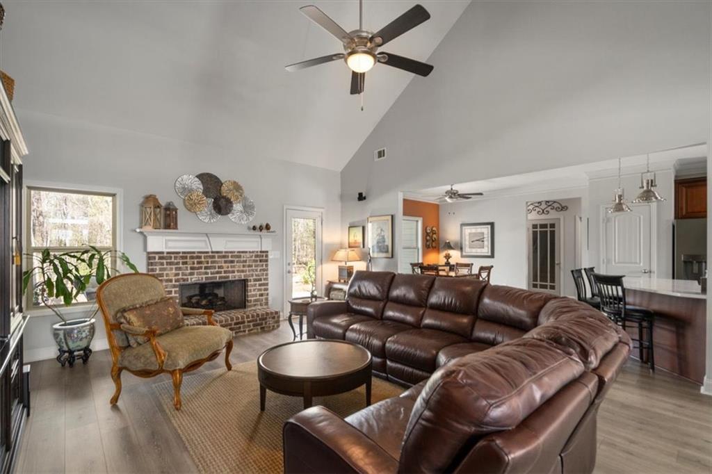 3065 Brooks Trail Monroe, GA 30656 - Photo 17 of 80 a living room with furniture and a fireplace