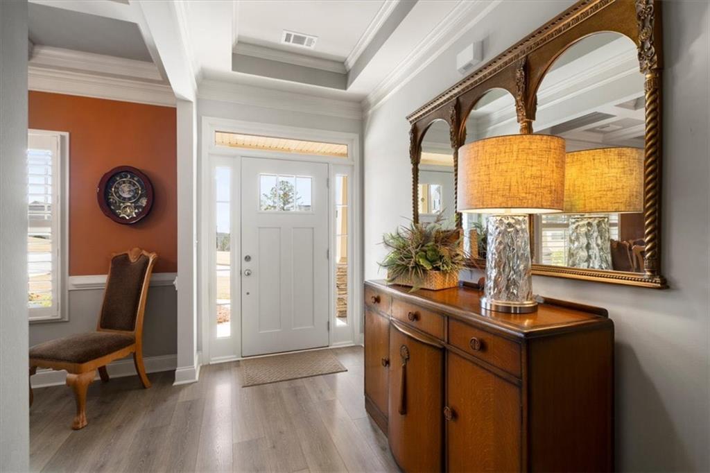 3065 Brooks Trail Monroe, GA 30656 - Photo 2 of 80 a view of a hallway with wooden floor and a window