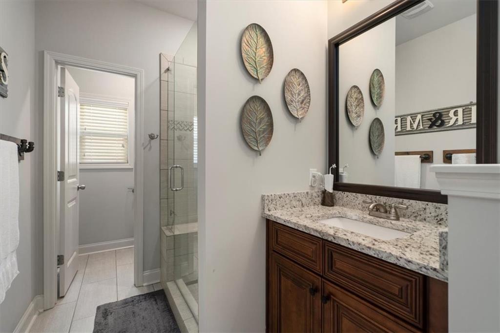 3065 Brooks Trail Monroe, GA 30656 - Photo 21 of 80 a bathroom with a sink and a mirror