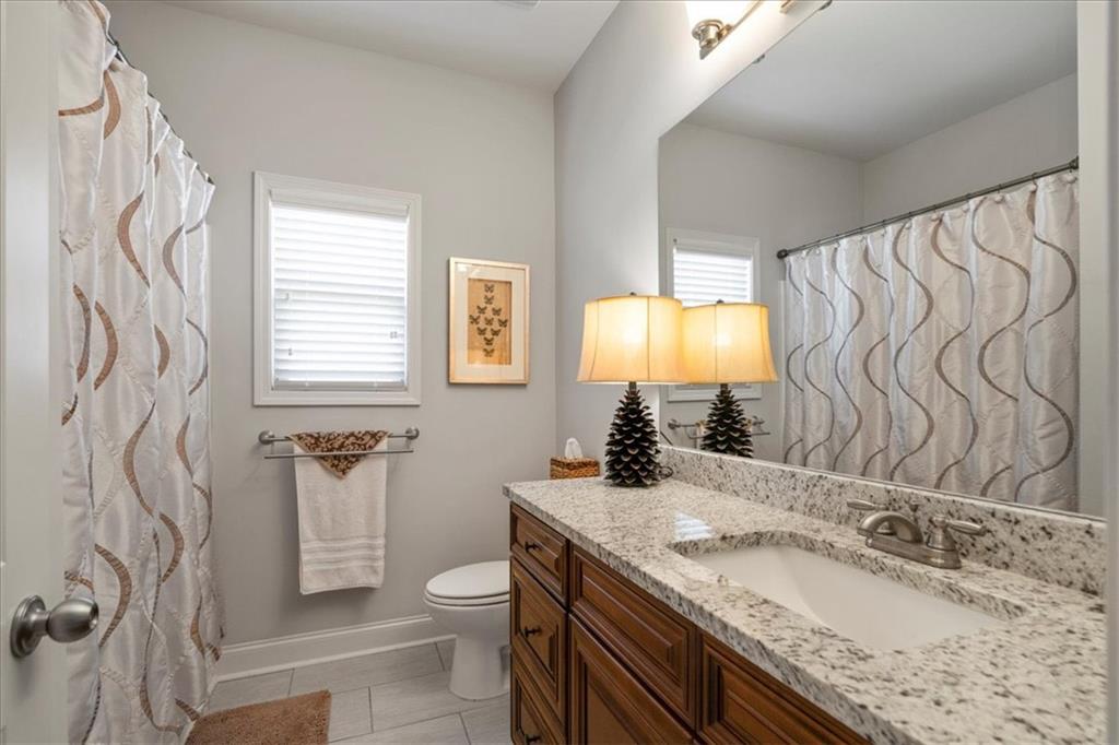 3065 Brooks Trail Monroe, GA 30656 - Photo 26 of 80 a bathroom with a granite countertop sink and a mirror