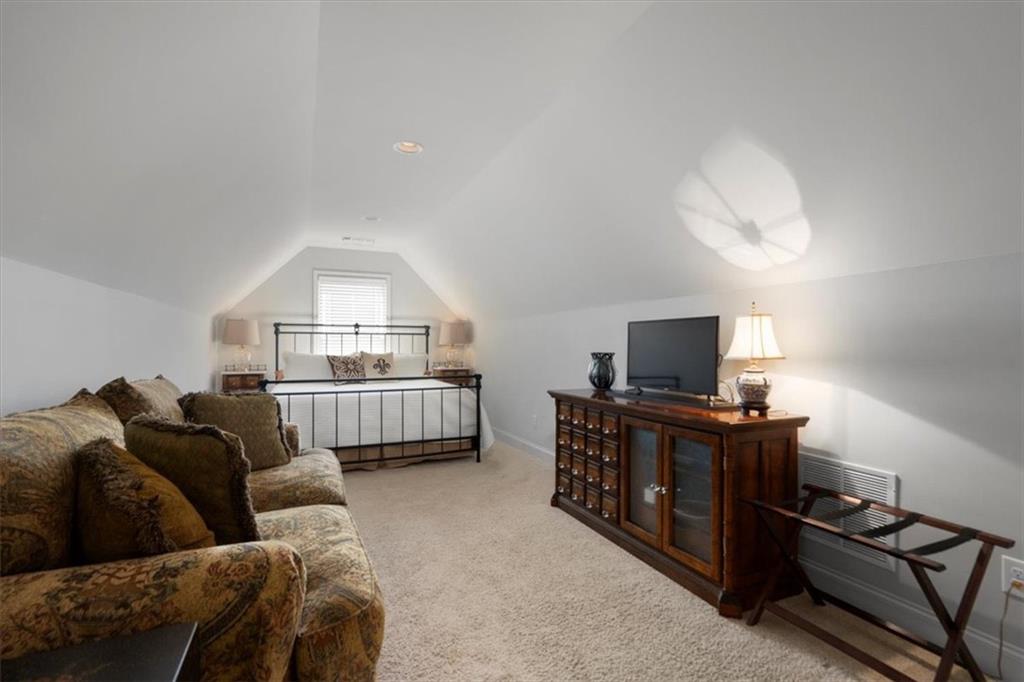 3065 Brooks Trail Monroe, GA 30656 - Photo 29 of 80 a living room with furniture and a flat screen tv