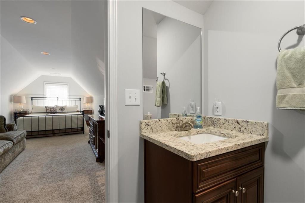 3065 Brooks Trail Monroe, GA 30656 - Photo 31 of 80 a en suite bathroom with a granite countertop sink and a mirror