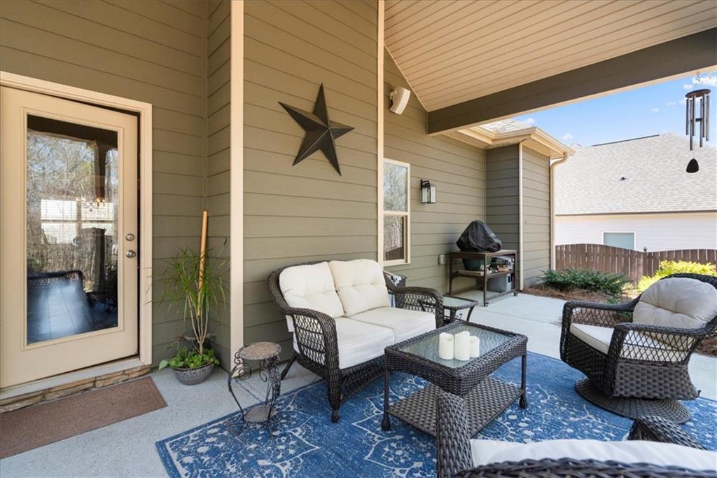 3065 Brooks Trail Monroe, GA 30656 - Photo 38 of 80 a living room with patio furniture and a potted plant