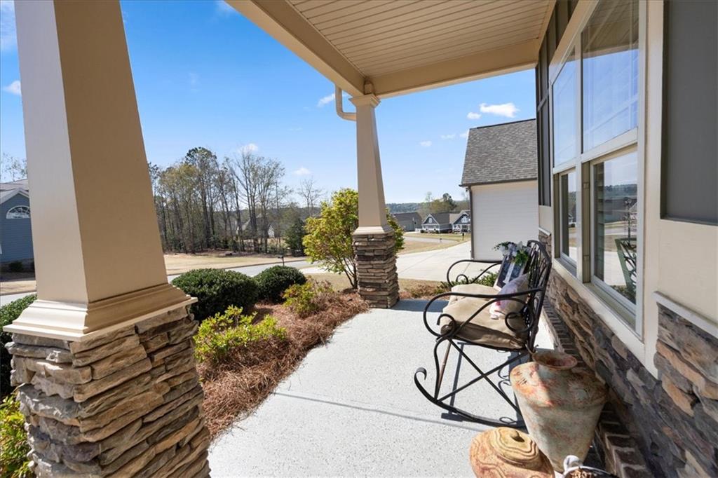 3065 Brooks Trail Monroe, GA 30656 - Photo 39 of 80 a view of a chairs and table in patio with a barbeque