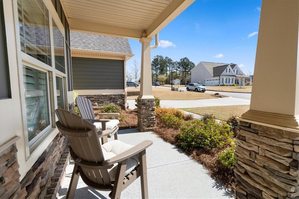 3065 Brooks Trail Monroe, GA 30656 - Photo 40 of 80 a view of a patio with table and chairs and potted plants