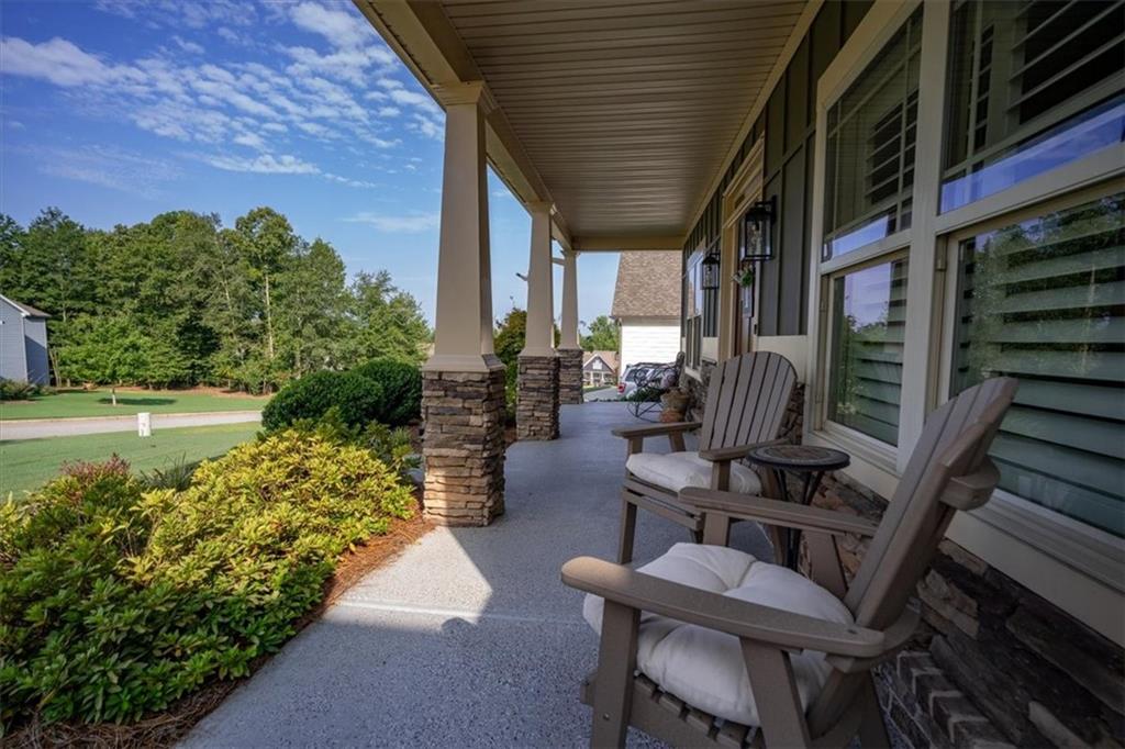 3065 Brooks Trail Monroe, GA 30656 - Photo 52 of 80 a view of a patio with table and chairs and potted plants