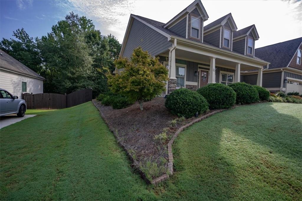 3065 Brooks Trail Monroe, GA 30656 - Photo 58 of 80 a front view of a house with a garden