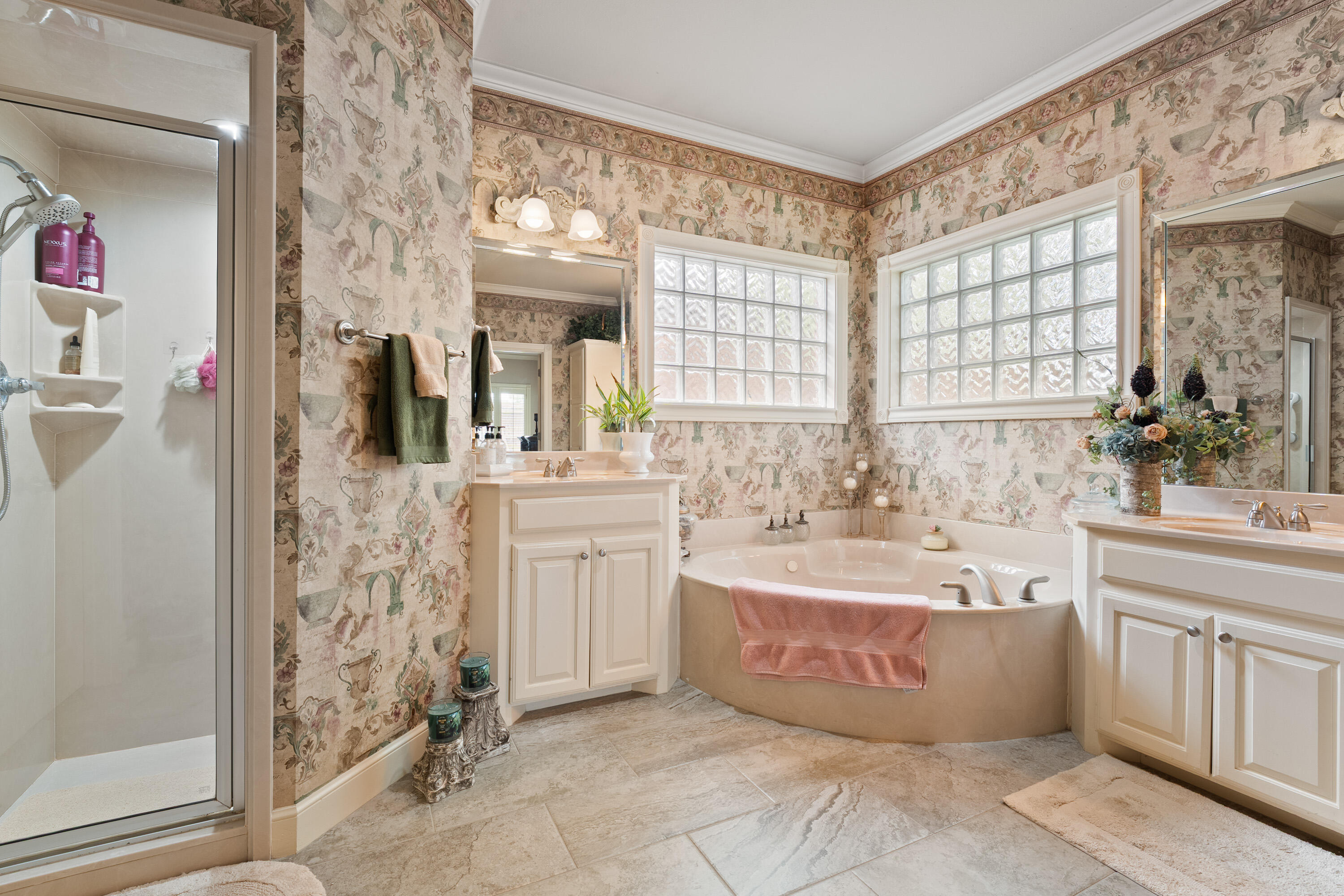 4813 101st Street Lubbock, TX 79424 - Photo 13 of 31 a spacious bathroom with a tub sink and mirror
