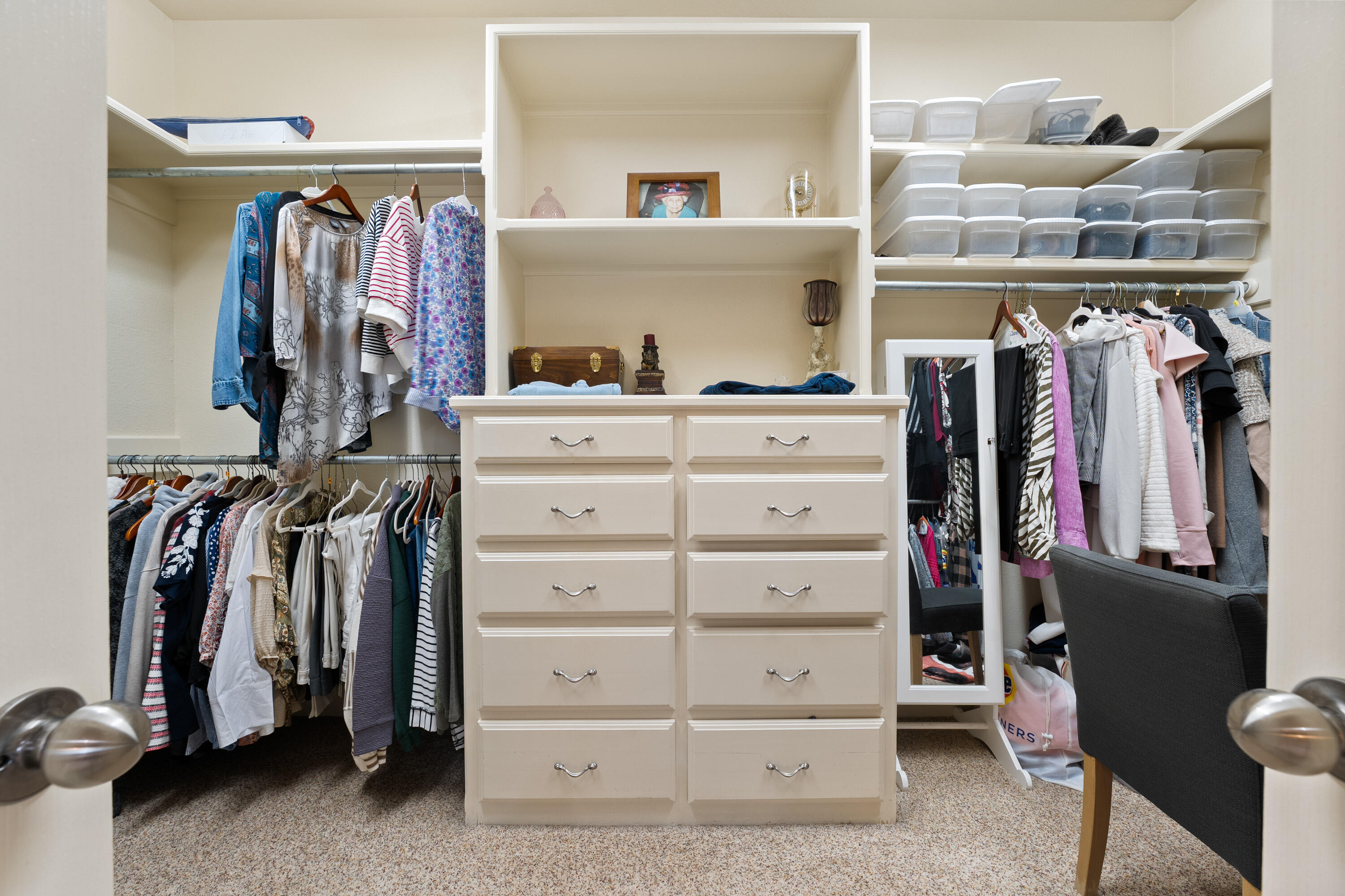 4813 101st Street Lubbock, TX 79424 - Photo 14 of 31 a view of walk in closet with clothes