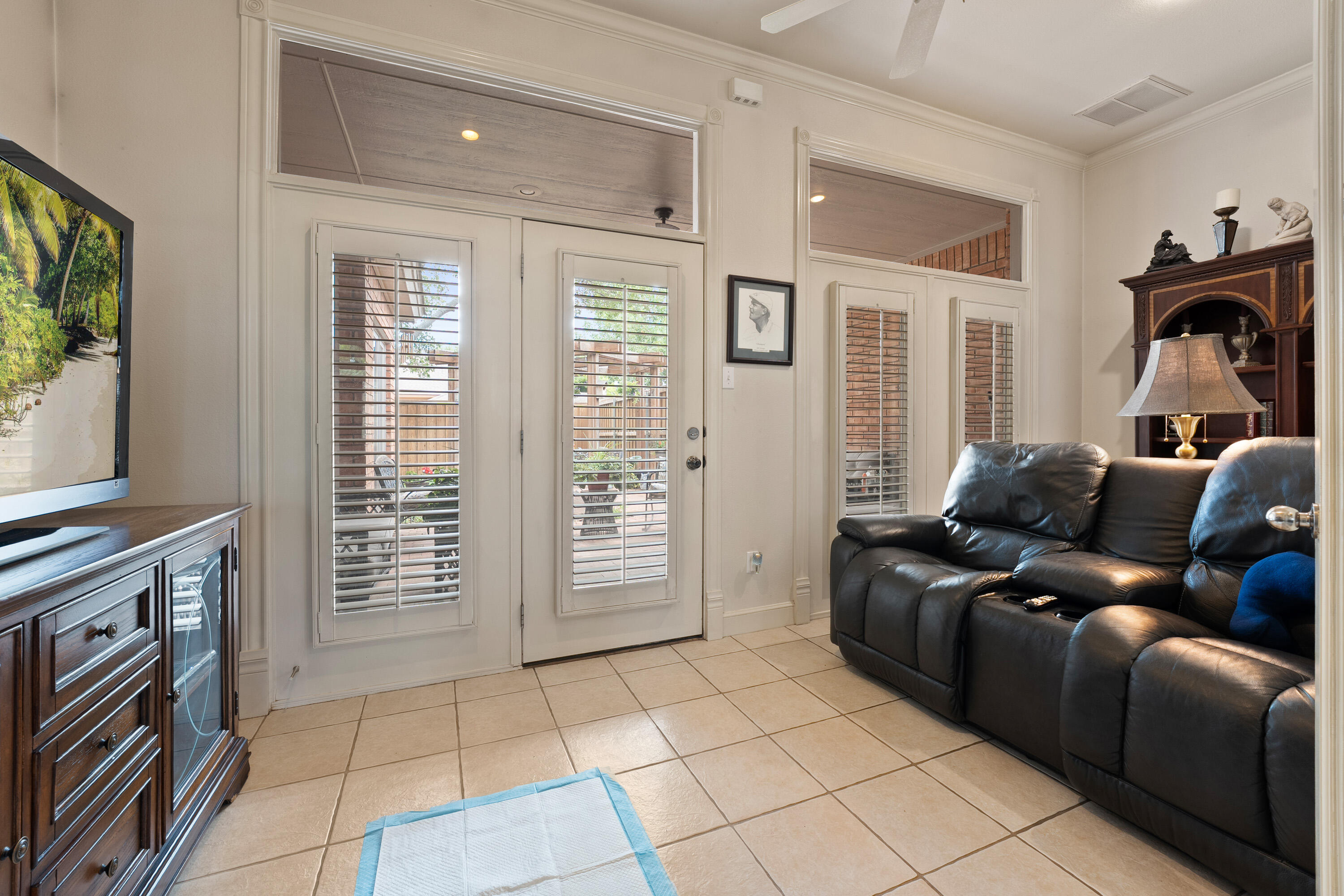 4813 101st Street Lubbock, TX 79424 - Photo 15 of 31 a living room with furniture and a flat screen tv