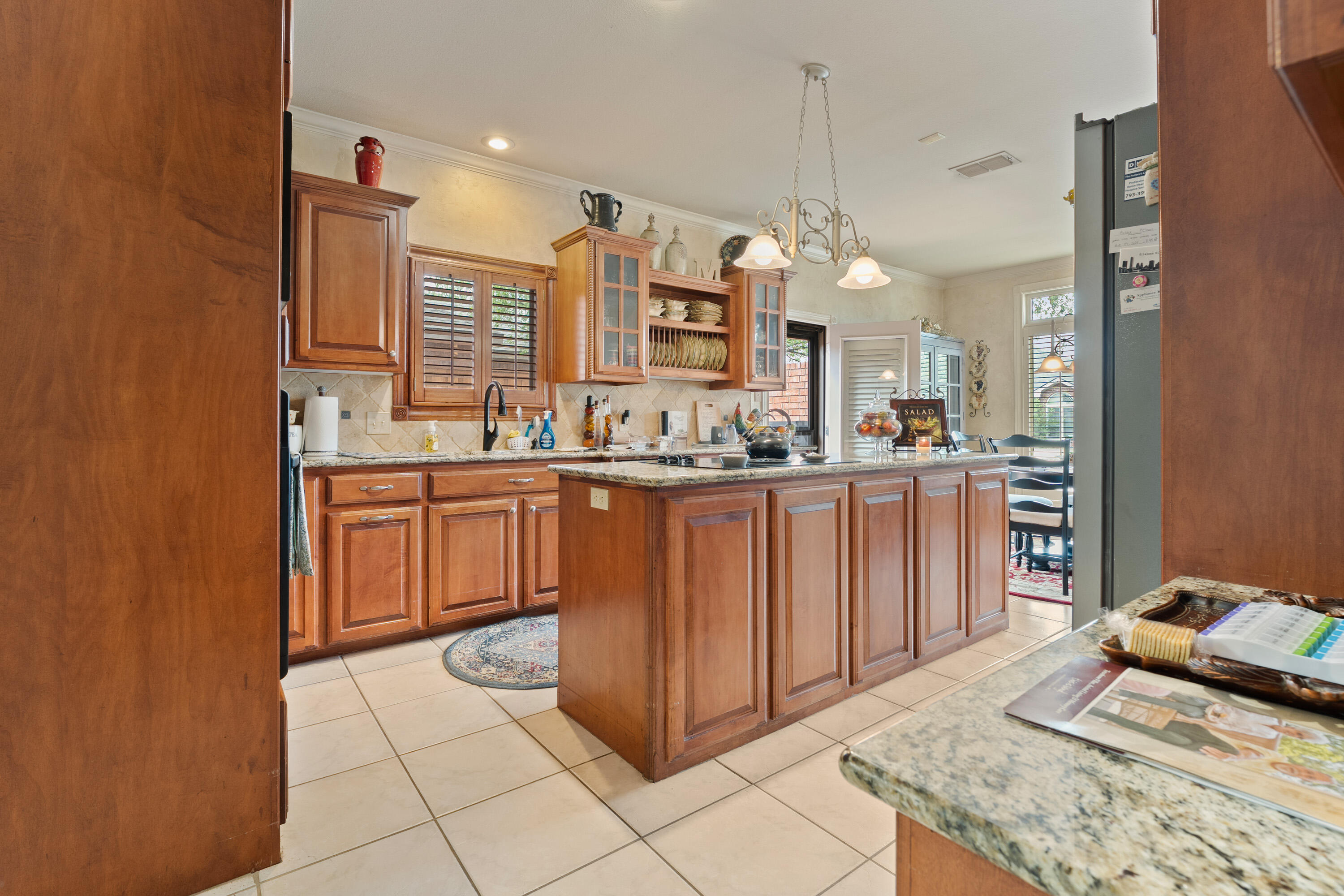 4813 101st Street Lubbock, TX 79424 - Photo 16 of 31 a kitchen with a sink and cabinets
