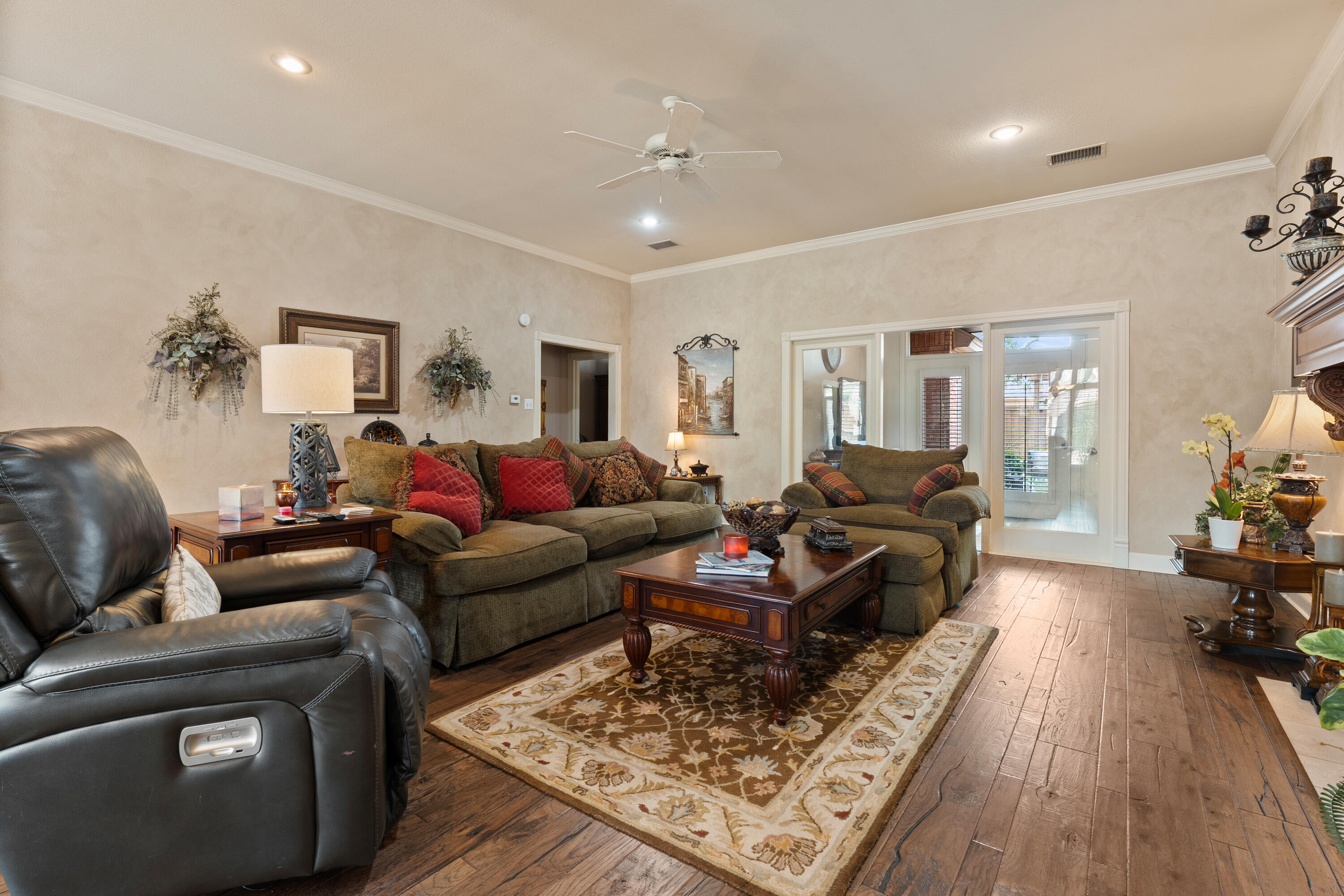 4813 101st Street Lubbock, TX 79424 - Photo 22 of 31 a living room with furniture and wooden floor