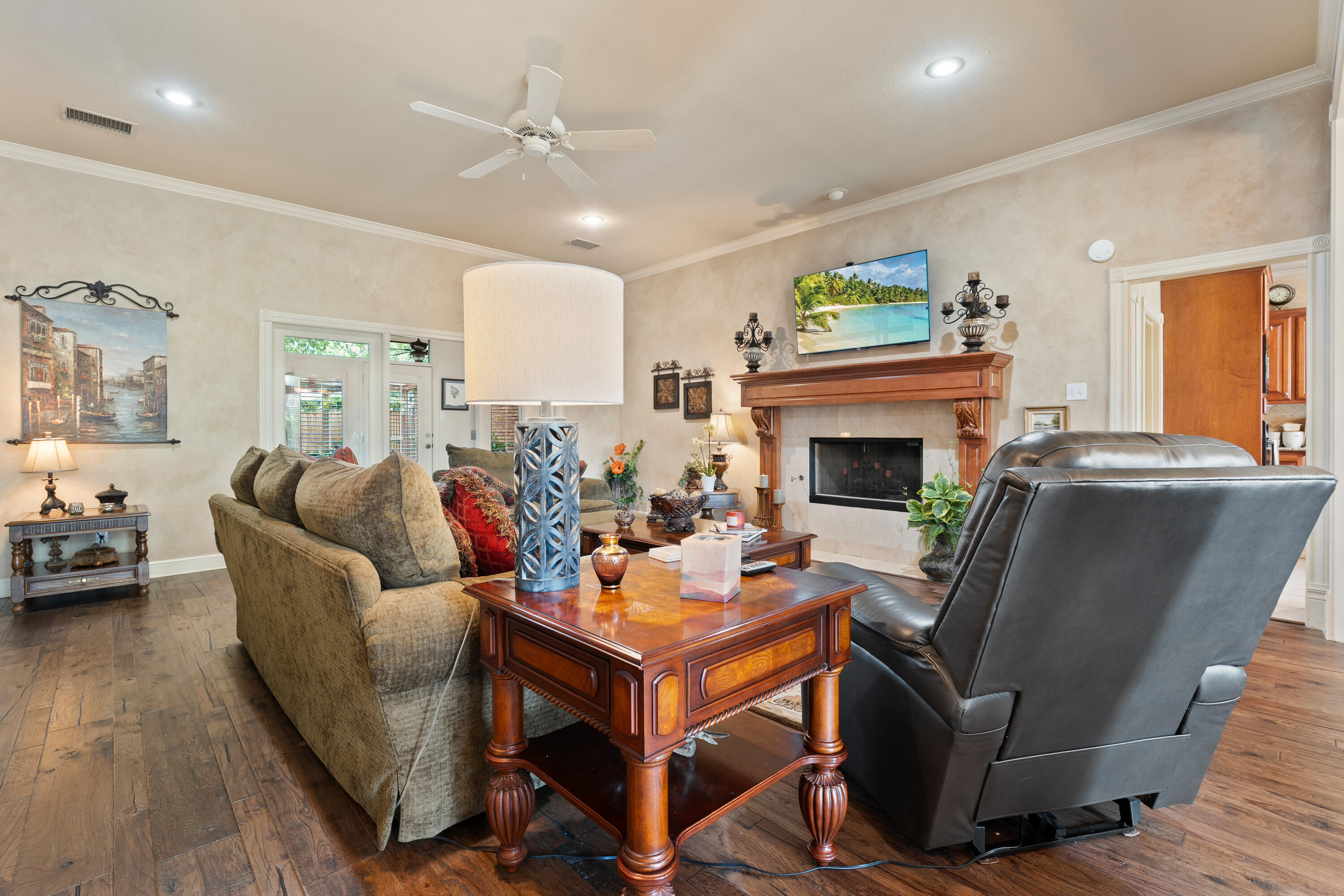 4813 101st Street Lubbock, TX 79424 - Photo 23 of 31 a living room with furniture and a fireplace