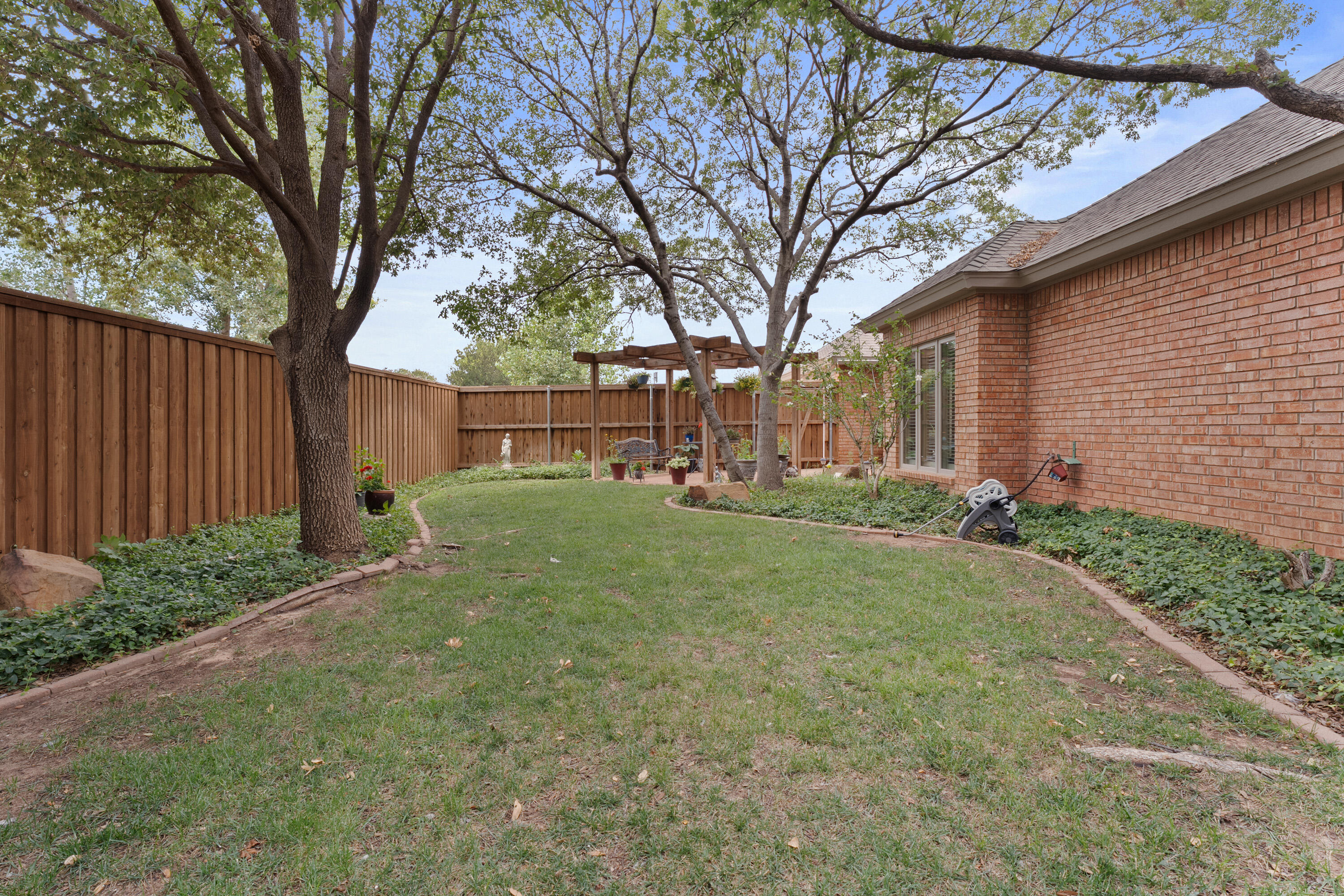4813 101st Street Lubbock, TX 79424 - Photo 31 of 31 a view of a house with yard and a tree