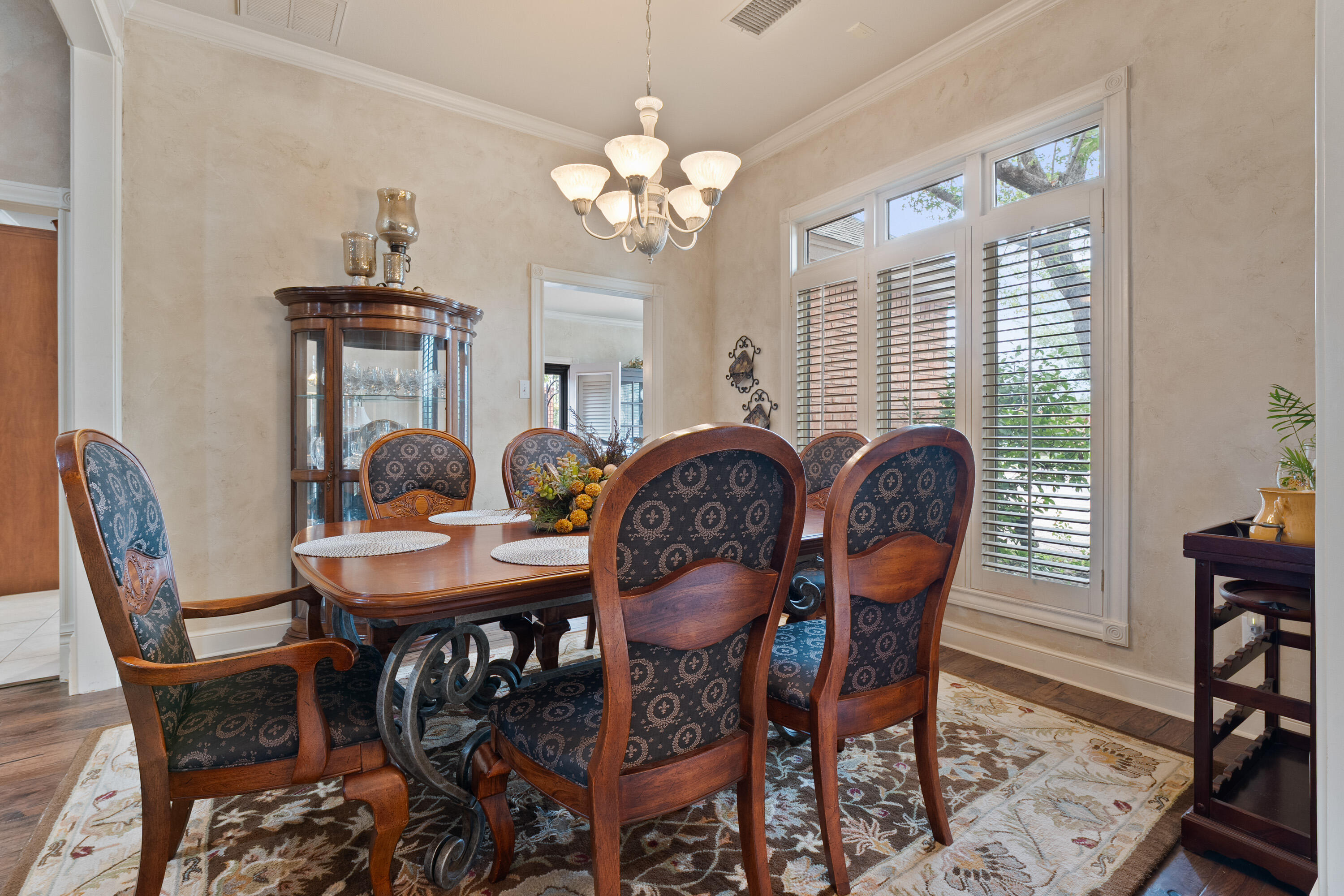 4813 101st Street Lubbock, TX 79424 - Photo 4 of 31 a view of a dining room with furniture and chandelier