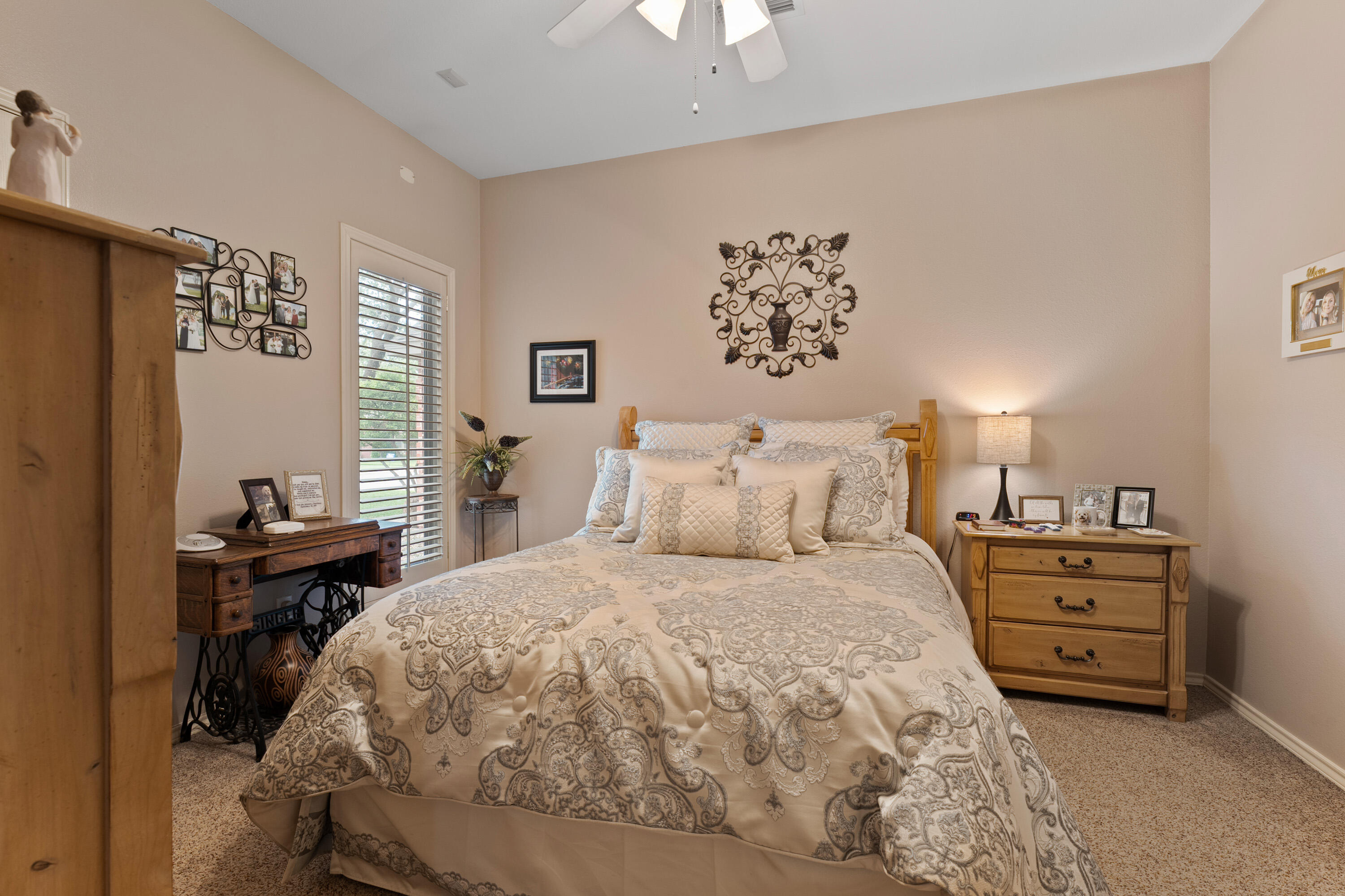4813 101st Street Lubbock, TX 79424 - Photo 7 of 31 a bedroom with a bed and a lamp on dresser