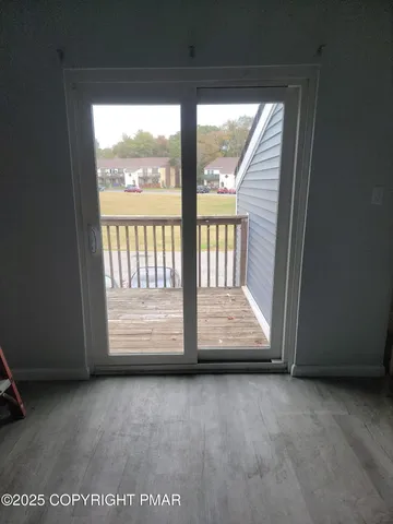 an empty room with wooden floor