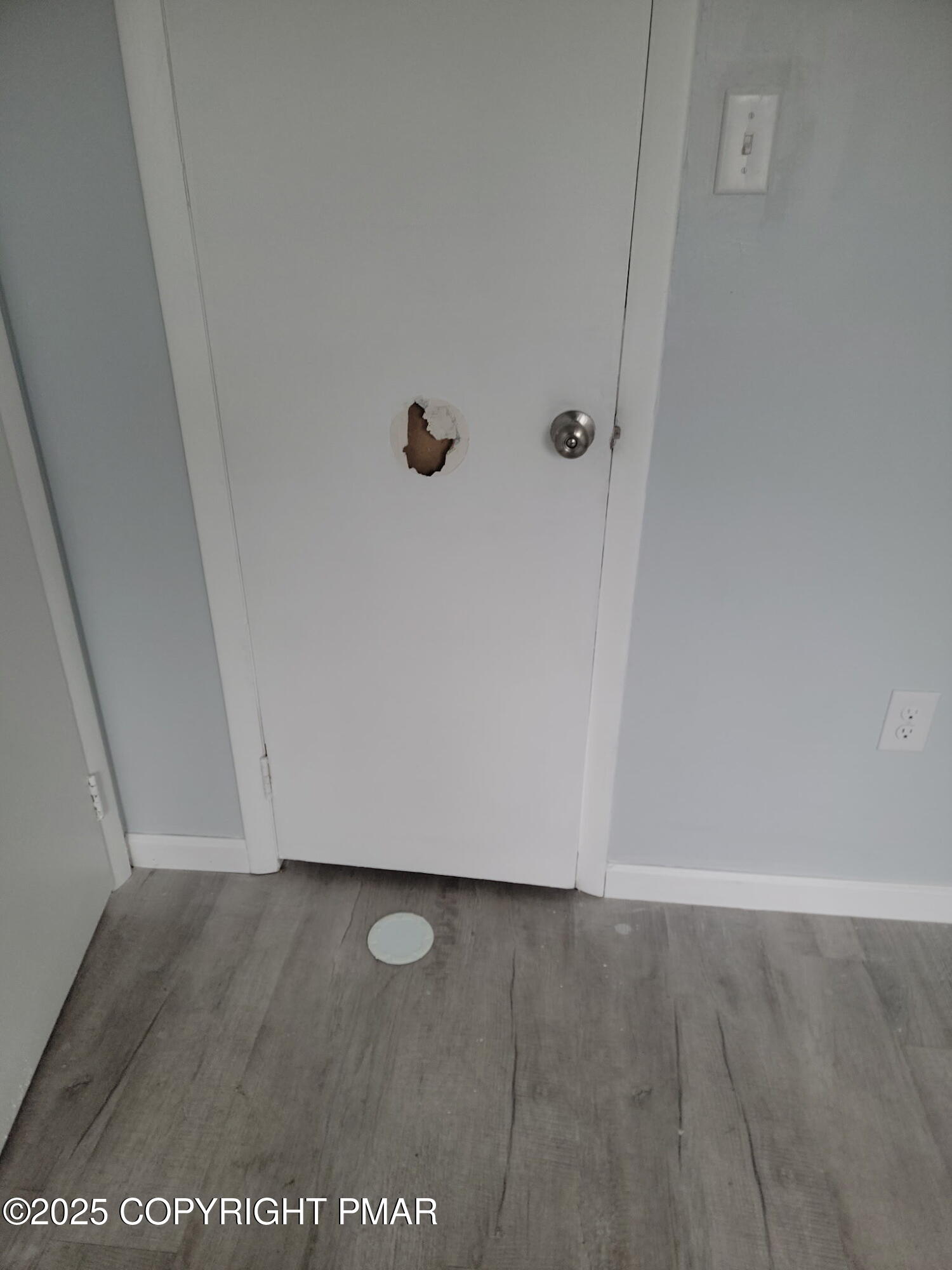 151 Snowshoe Court, Unit 204 Mount Pocono, PA 18344 - Photo 3 of 8 an empty room with wooden floor