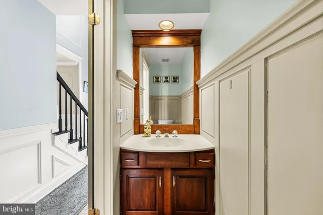 a bathroom with a sink and a mirror