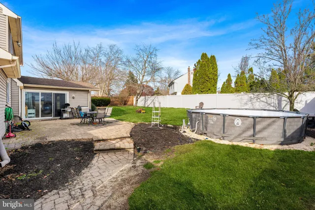 a view of a backyard with sitting area
