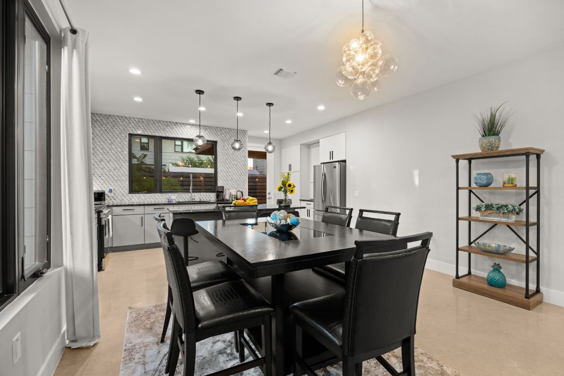 3610 Thompson Street, Unit 1 Austin, TX 78702 - Photo 12 of 39 a view of a dining room with furniture and wooden floor