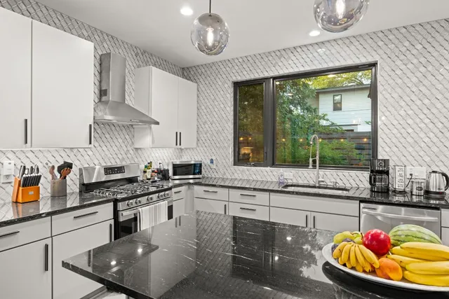 a bedroom with a bed and a lamp