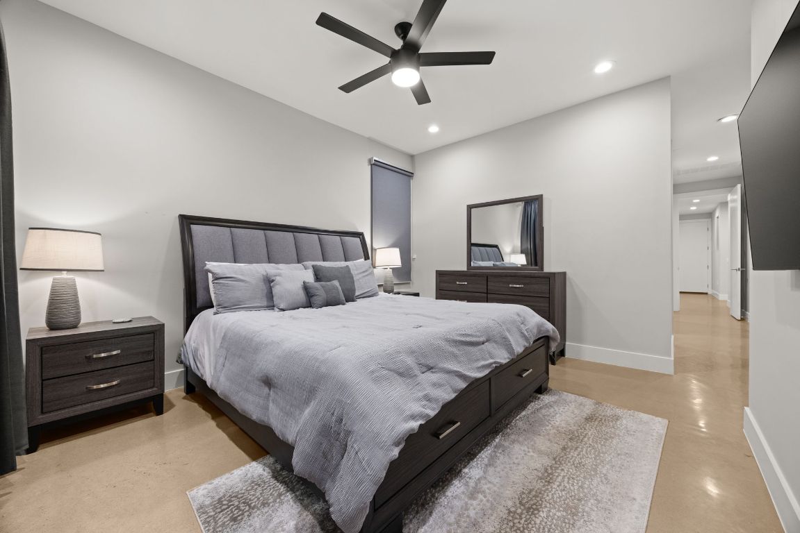 3610 Thompson Street, Unit 1 Austin, TX 78702 - Photo 22 of 39 a bedroom with a bed and a lamp