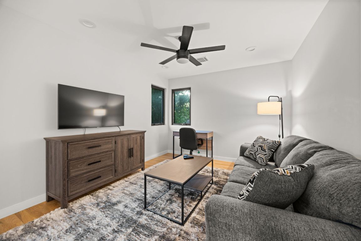 3610 Thompson Street, Unit 1 Austin, TX 78702 - Photo 30 of 39 a living room with furniture and a flat screen tv