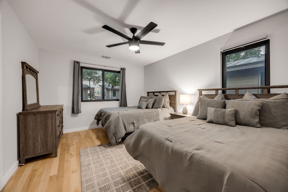 3610 Thompson Street, Unit 1 Austin, TX 78702 - Photo 32 of 39 a bedroom with two beds and a window