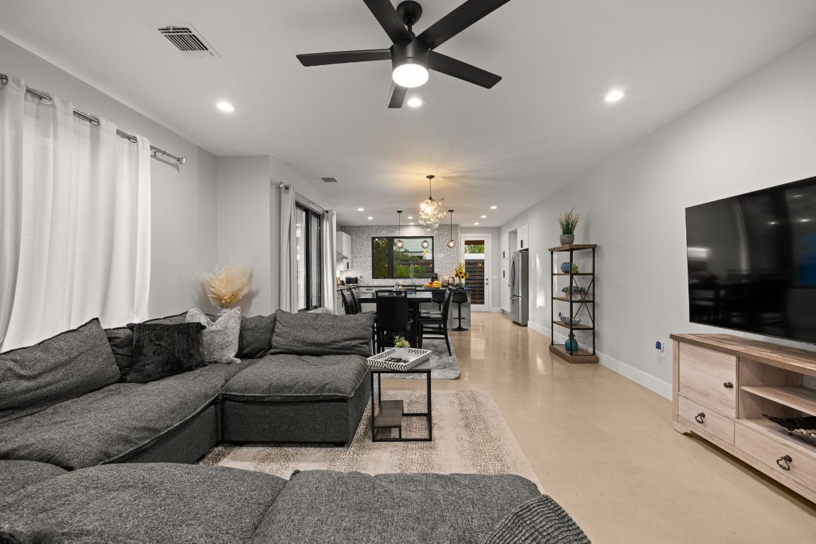 3610 Thompson Street, Unit 1 Austin, TX 78702 - Photo 10 of 39 a living room with furniture and a flat screen tv