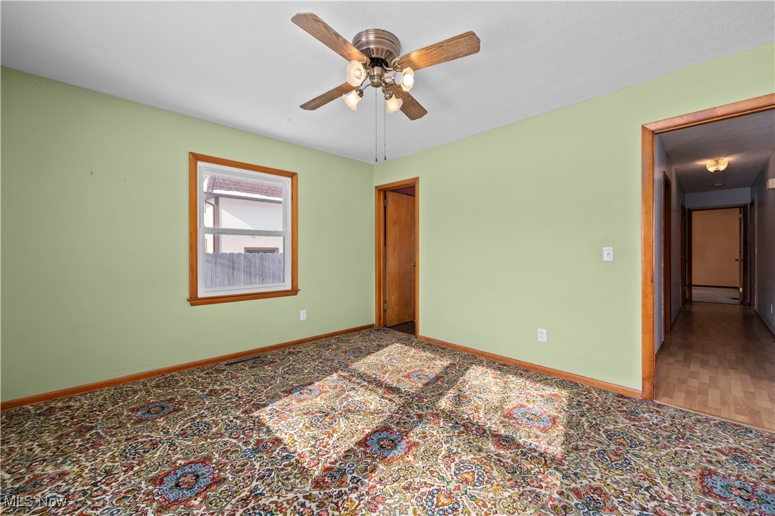 14015 West Lake Road Vermilion, OH 44089 - Photo 33 of 50 Empty room with baseboards and a ceiling fan