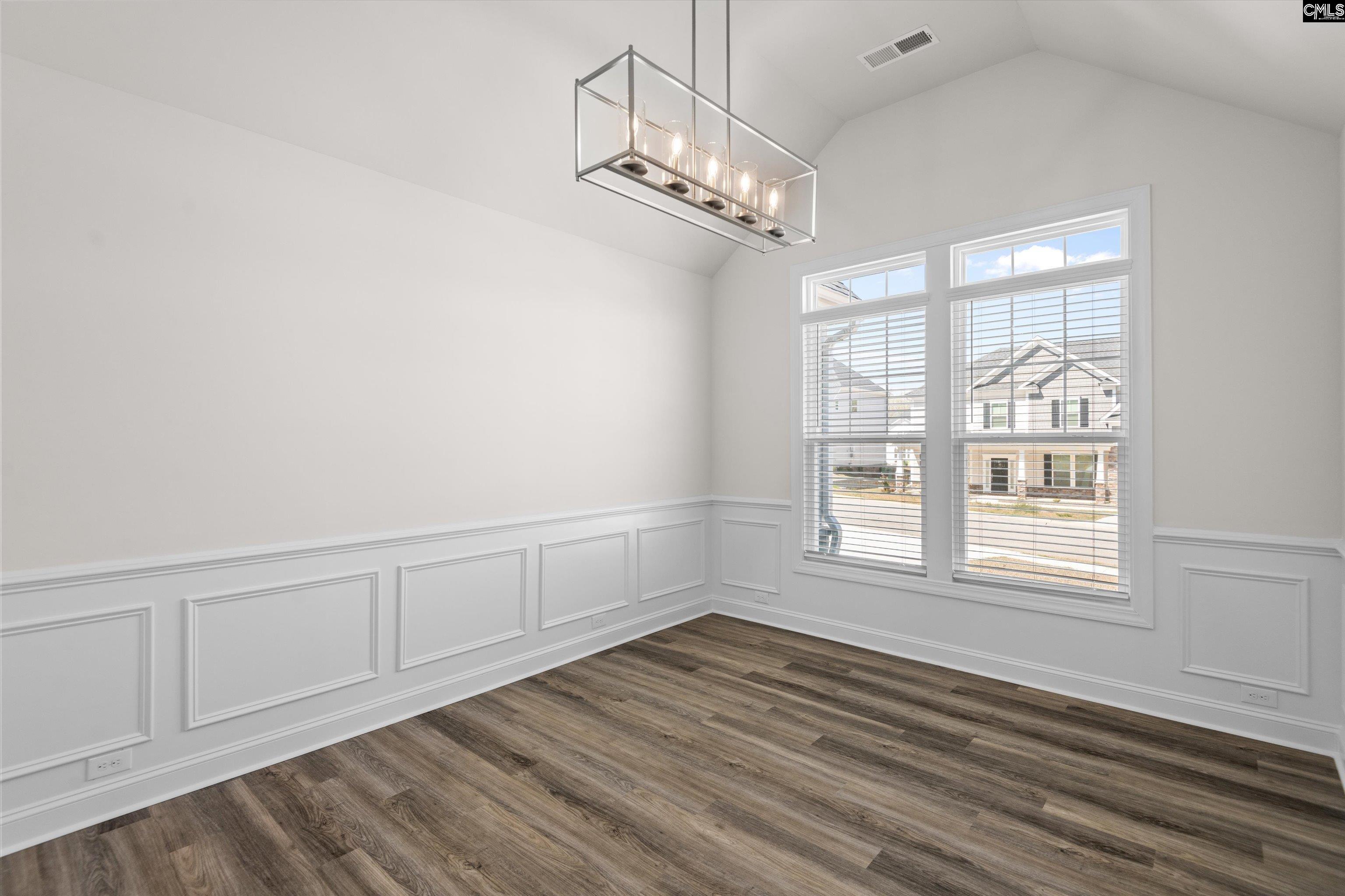 558 Wild Ginger Loop Irmo, SC 29063 - Photo 4 of 42 wooden floor in an empty room with a window