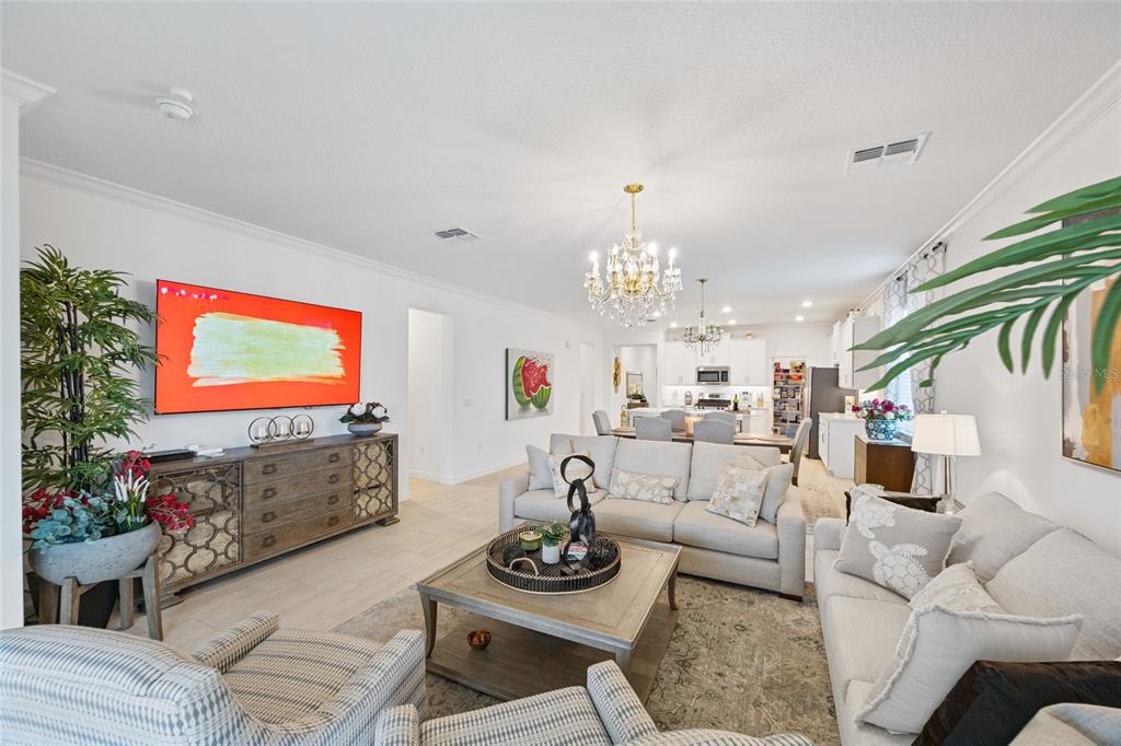 5513 Little Path Drive Wimauma, FL 33598 - Photo 15 of 40 a living room with furniture and a flat screen tv