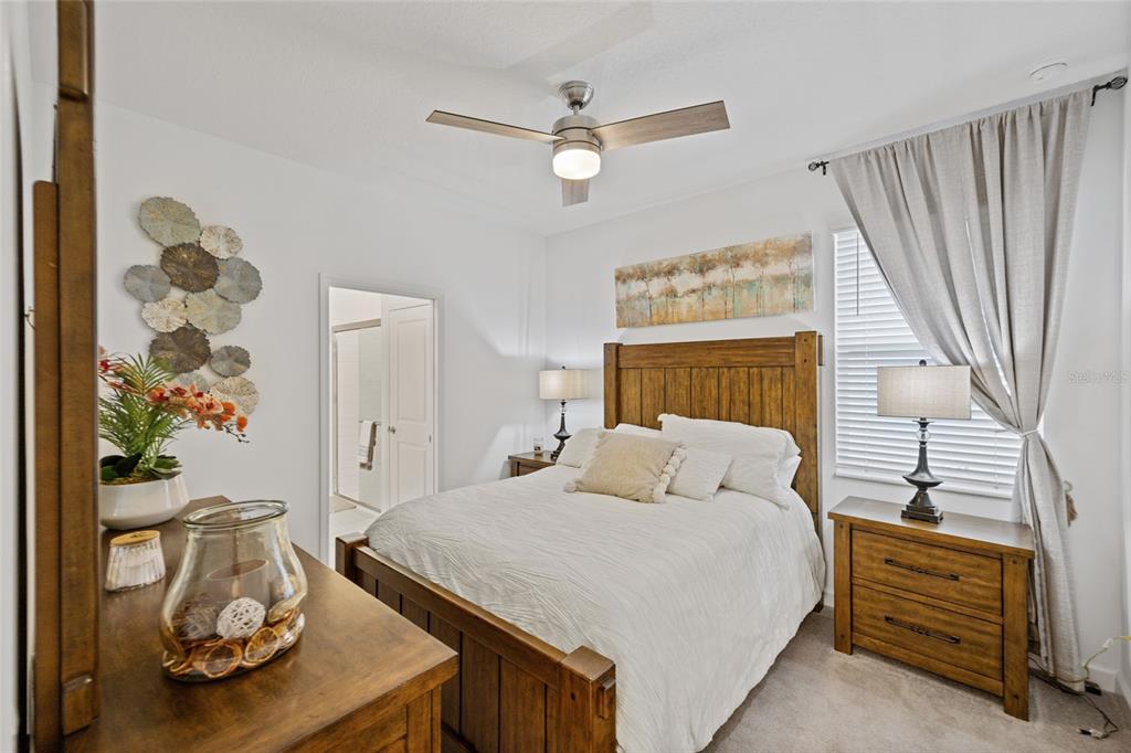 5513 Little Path Drive Wimauma, FL 33598 - Photo 23 of 40 a bedroom with a bed and a dresser