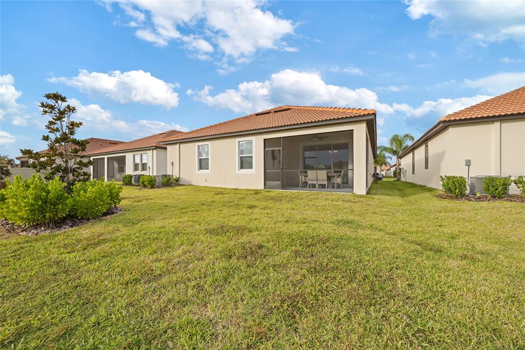 5513 Little Path Drive Wimauma, FL 33598 - Photo 34 of 40 a view of a house with backyard and garden