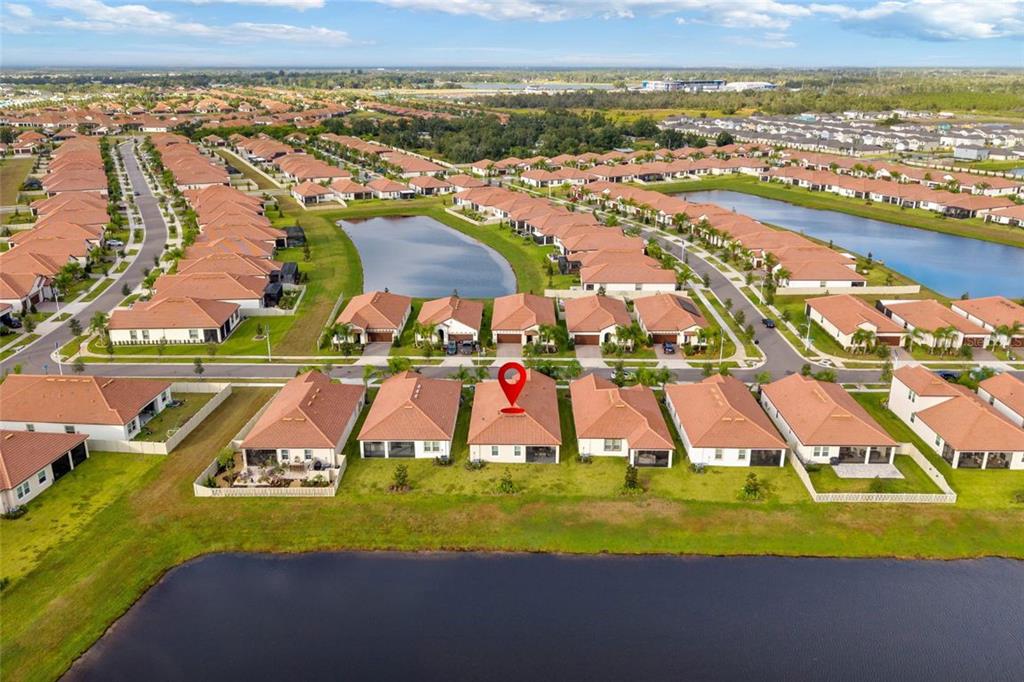 5513 Little Path Drive Wimauma, FL 33598 - Photo 37 of 40 an aerial view of residential houses with outdoor space and swimming pool