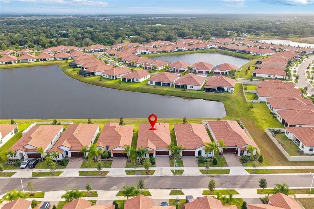 5513 Little Path Drive Wimauma, FL 33598 - Photo 39 of 40 an aerial view of residential houses with outdoor space and ocean view