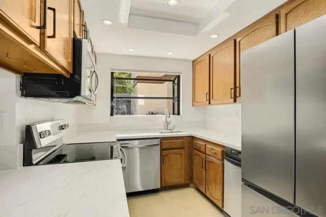 a kitchen with a stove and a sink
