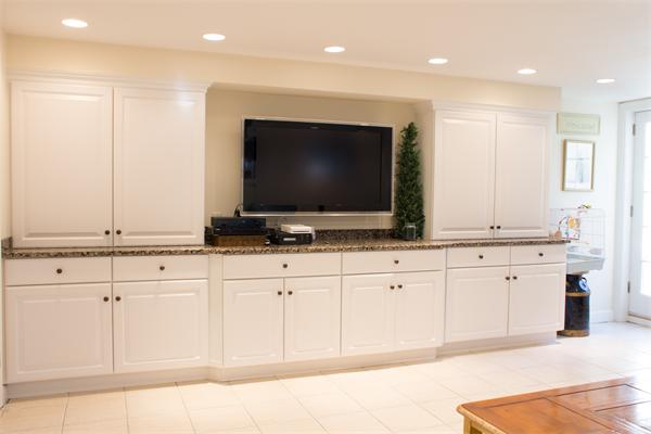 10 Cushing Road Wellesley, MA 02481 - Photo 16 of 20 a living room with granite countertop furniture and a flat screen tv