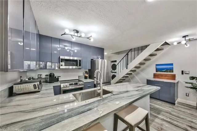 a kitchen with granite countertop lots of counter top space