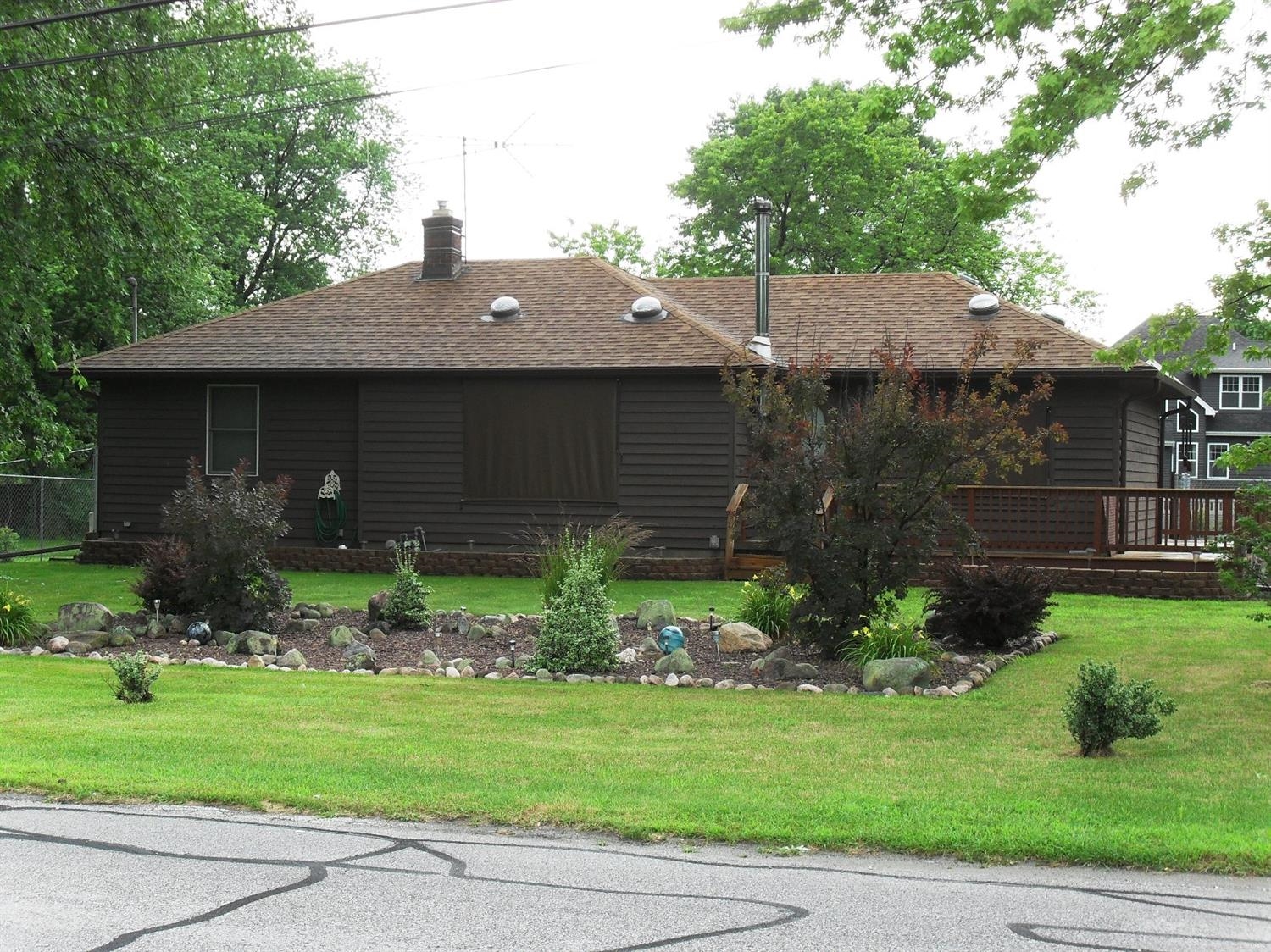 9006 Kleinman Road Highland, IN 46322 - Photo 1 of 10 a front view of a house with garden