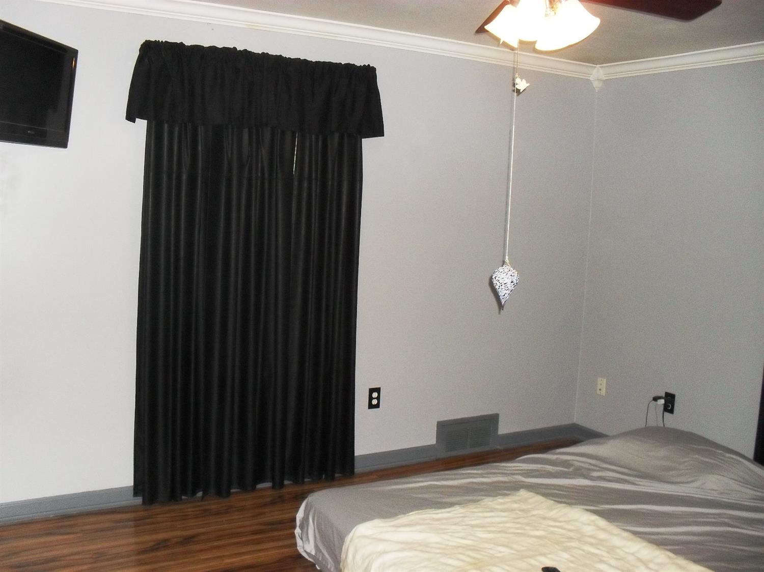 9006 Kleinman Road Highland, IN 46322 - Photo 10 of 10 a bedroom with a bed and a mirror