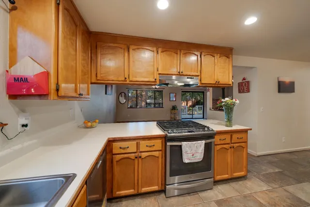 a kitchen with a stove and a sink