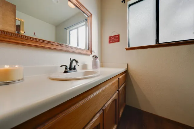 a bathroom with a sink and a mirror